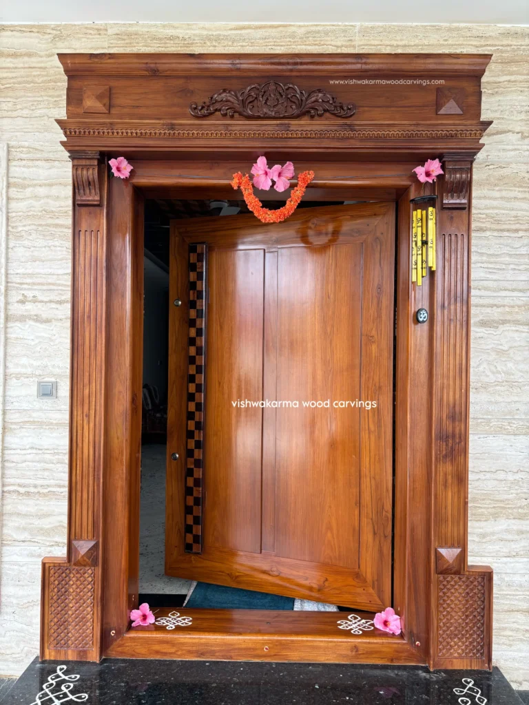 Hand-carved wooden entrance door with floral design by Vishwakarma Wood Carvings