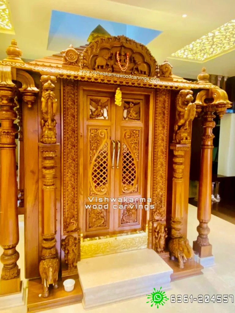 Wooden mandir with carved pillars and arch detailing by Vishwakarma Wood Carvings