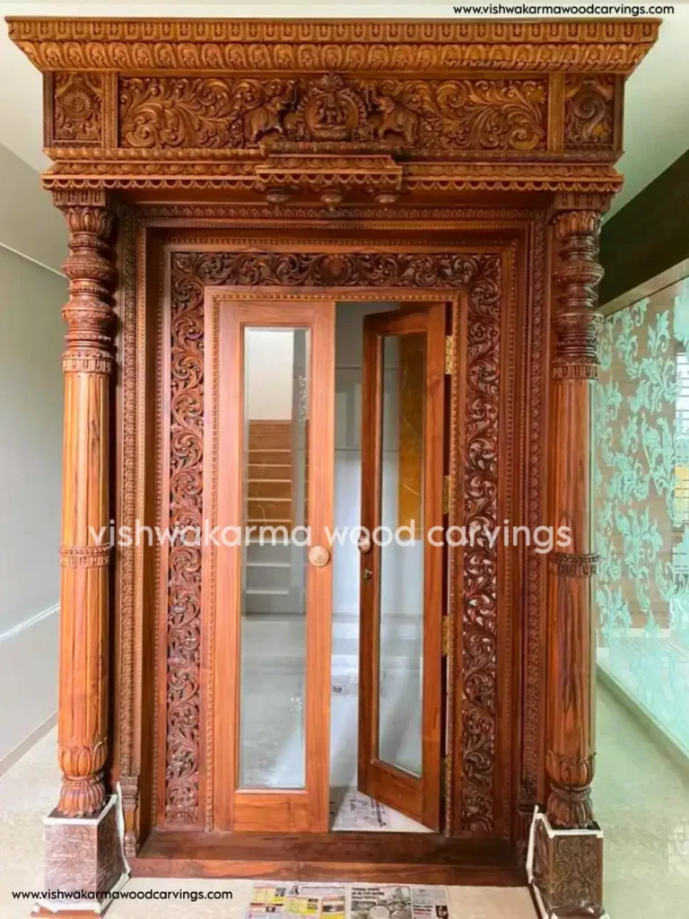 Hand-carved wooden main door for home entry by Vishwakarma Wood Carvings