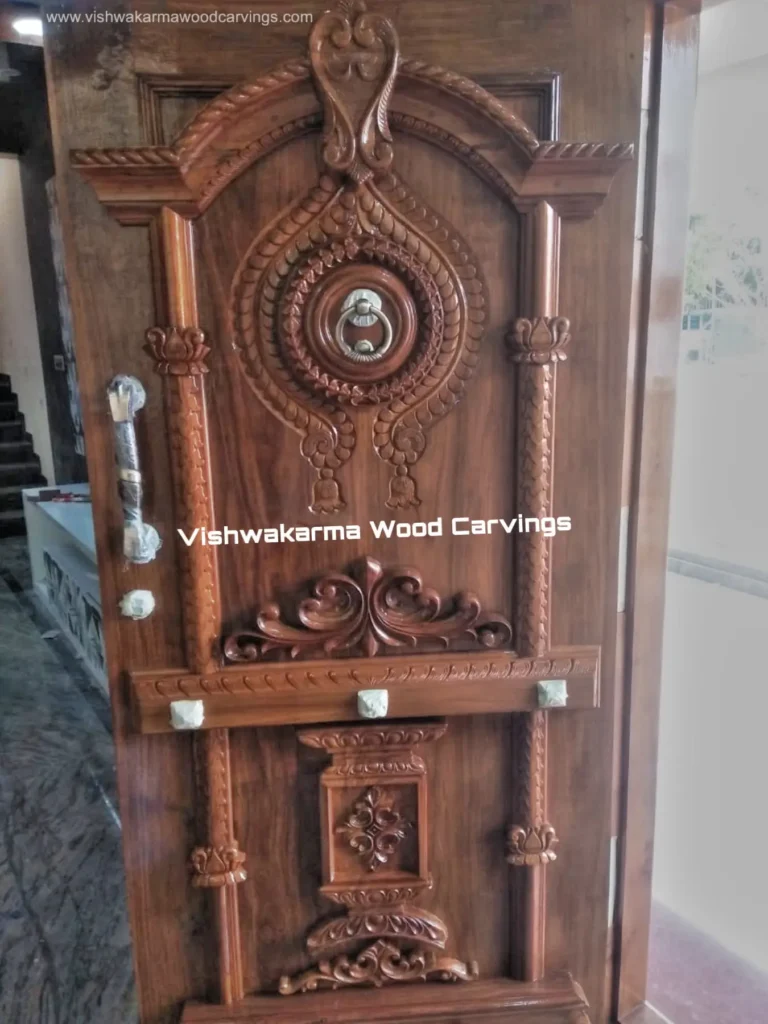 Handcrafted wooden main door with traditional carvings and premium finish